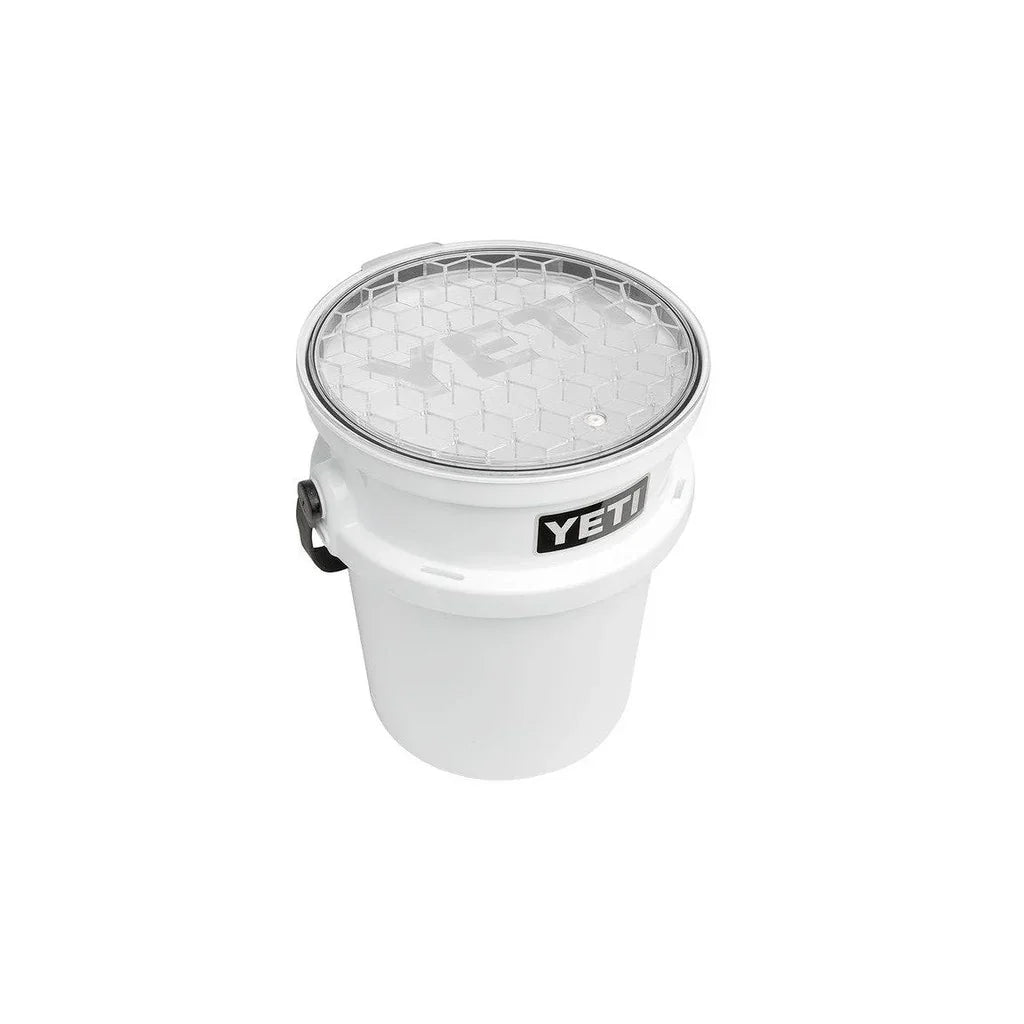 White YETI LoadOut bucket with clear hex-pattern lid for outdoor storage.