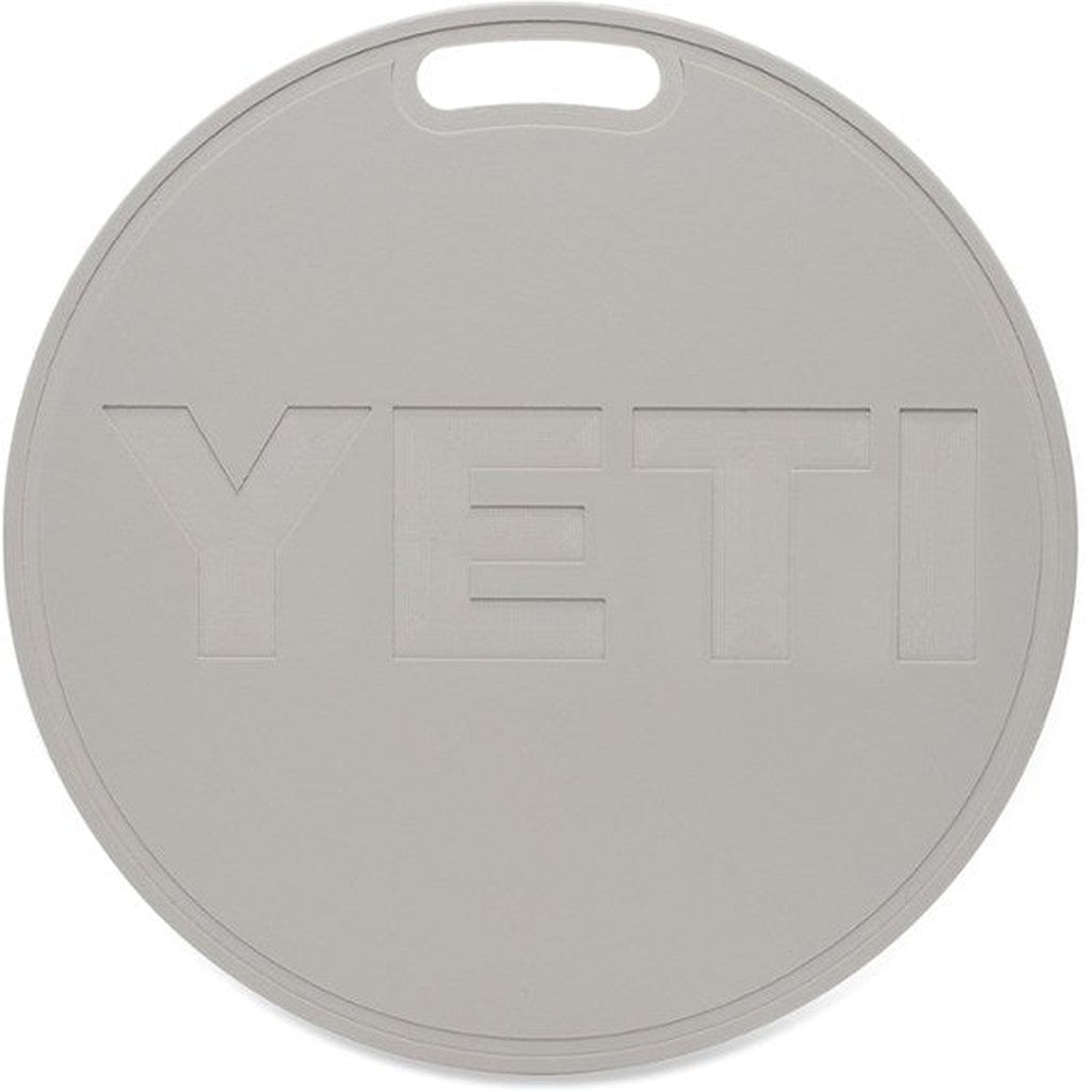 Round grey YETI cooler lid with integrated handle, outdoor accessory